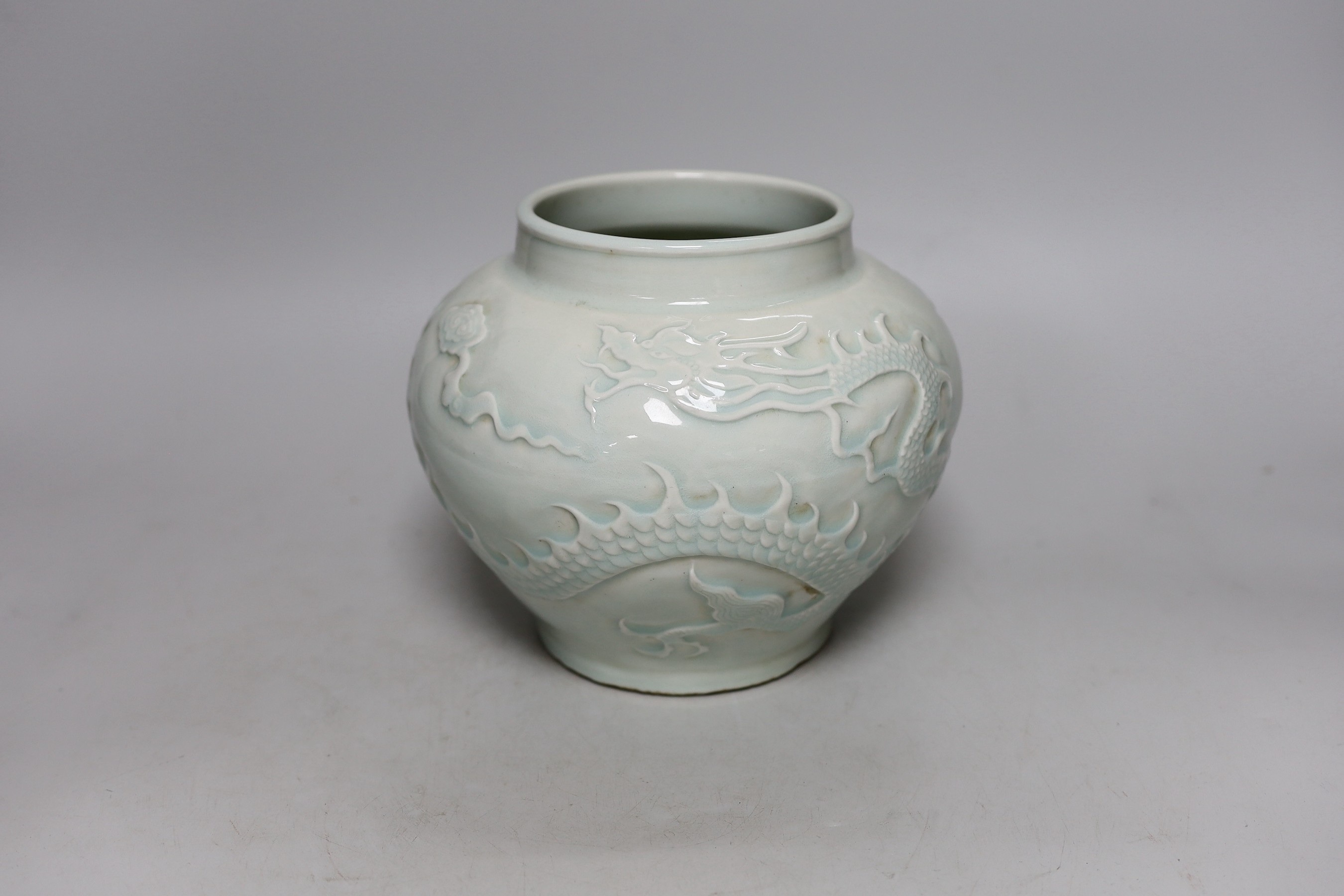 A Chinese relief moulded ‘dragon’ vase, 17cms